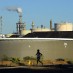 BIG OIL TANKS CALIFORNIA MEASURE TO CUT PETROLEUM USE IN HALF